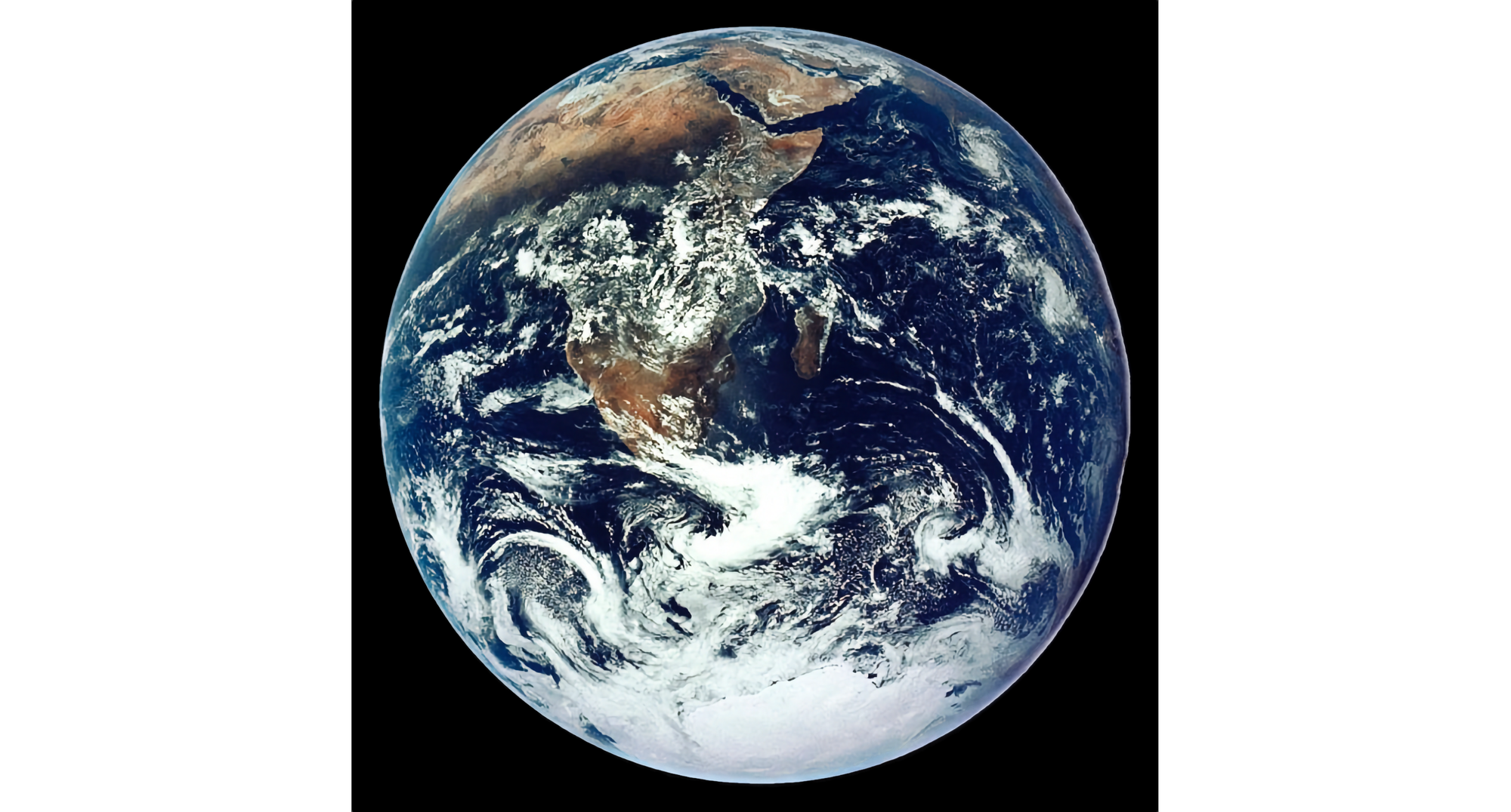 Photo of full earth taken from outer space, with clouds, water, and land