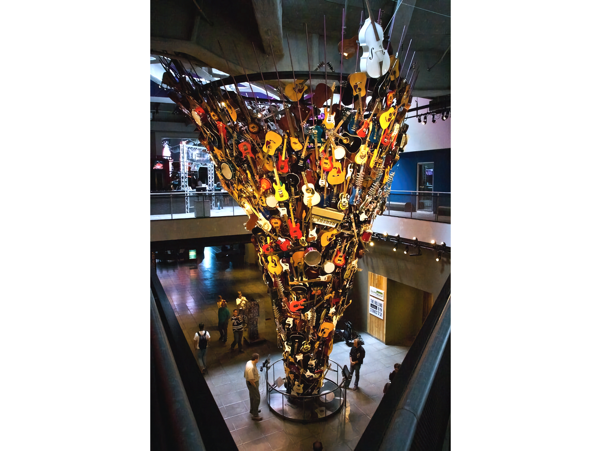 Photo of tower of guitars inside a museum space