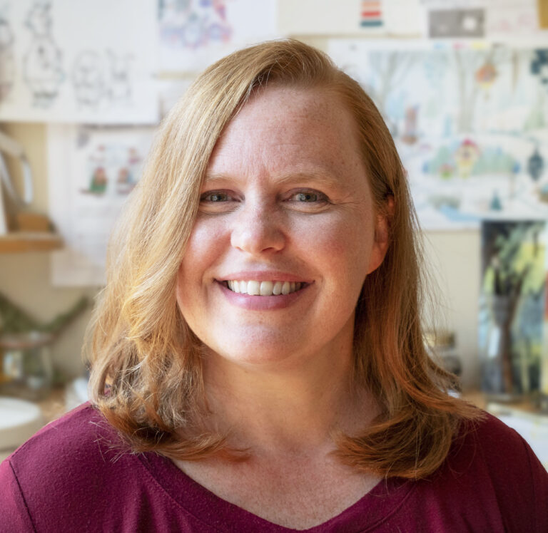 Photo of artist Eliza Wheeler looking directly at camera